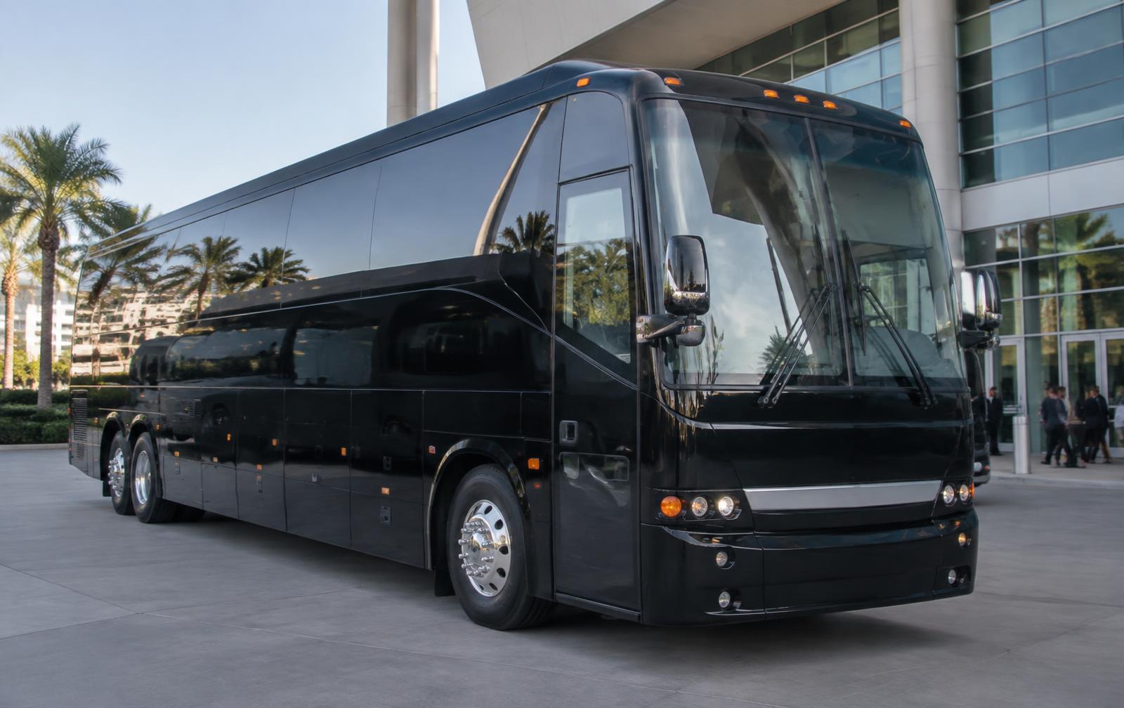 Black unbranded 40 Passenger Van Hool CX35 used for charter group transportation